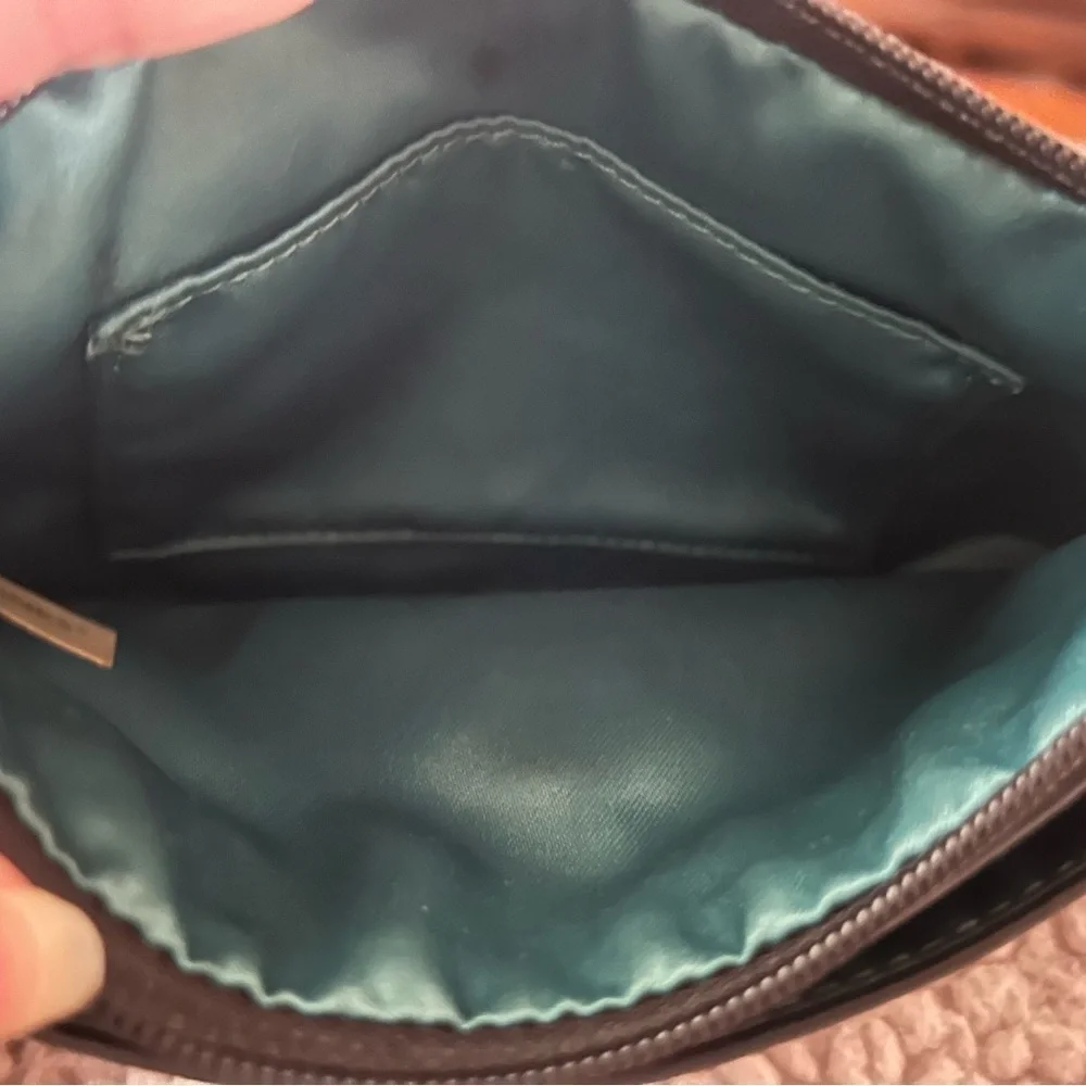 Coach vintage wristlet. Turn-lock silver hardware. Soft pebbled leather. Hangtag